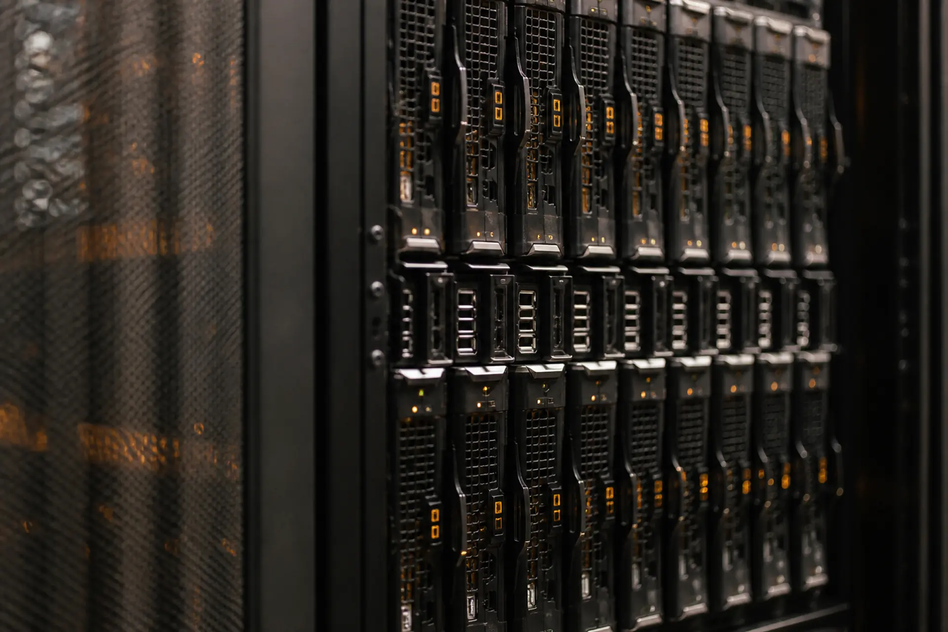 Dense inference blade chassis packed with GPU modules and soft amber glow.